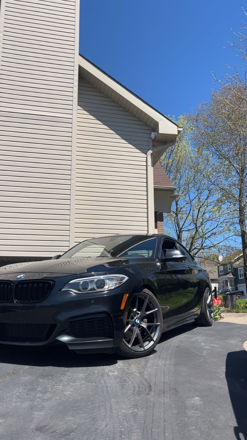 Installed custom wheel fitment on a black coupe